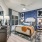 bedroom on wood-style flooring with ample spacious leading into a doorway
