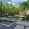 Tranquil courtyard with hammocks, fountains, and zen garden