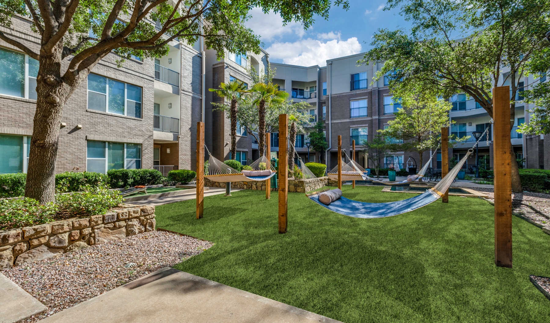 Perfectly Designed Tranquil courtyard with hammocks, fountains, and zen garden
